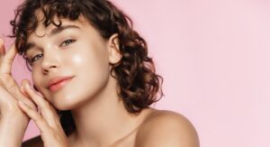 Smiling woman with bright, refreshed skin after her Hydrafacial treatment