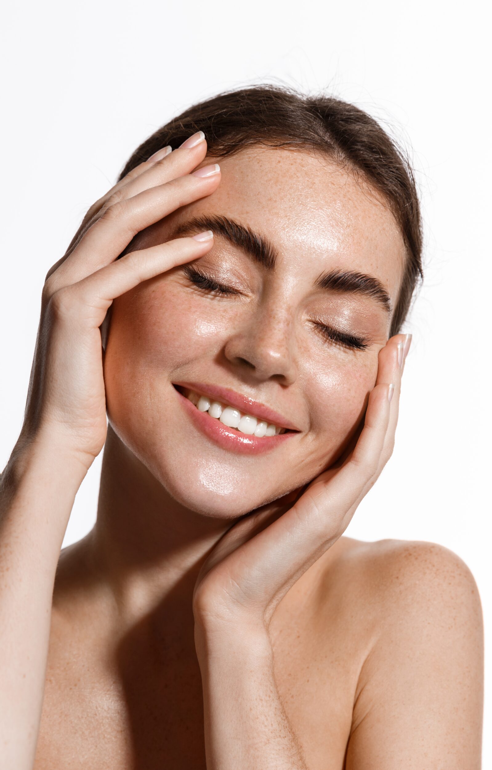 Smiling woman with glowing, dewy skin after getting a PRX Derm Perfexion "Unicorn" Facial for skin revitalization